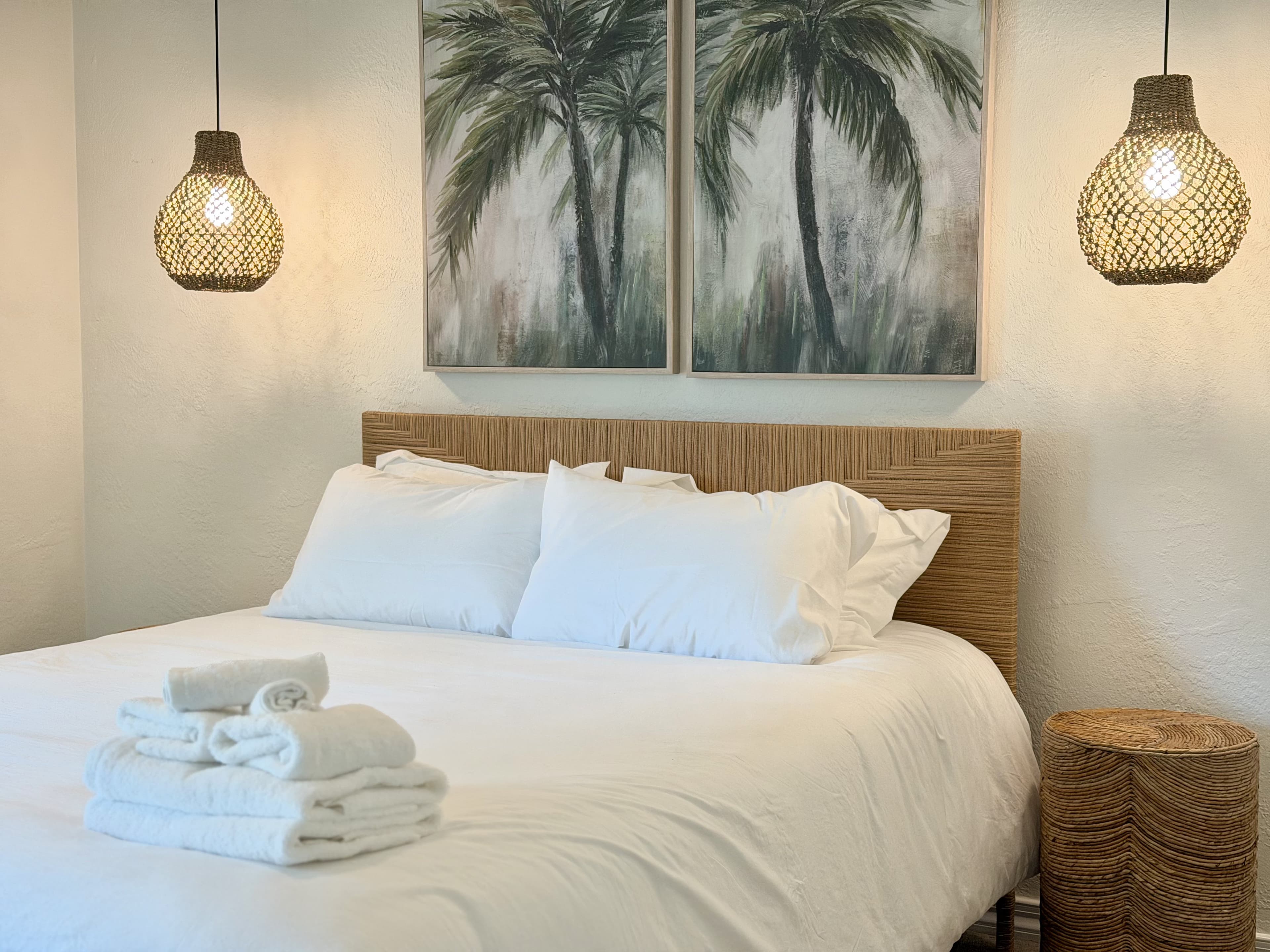 Boho bedroom with palm pendants