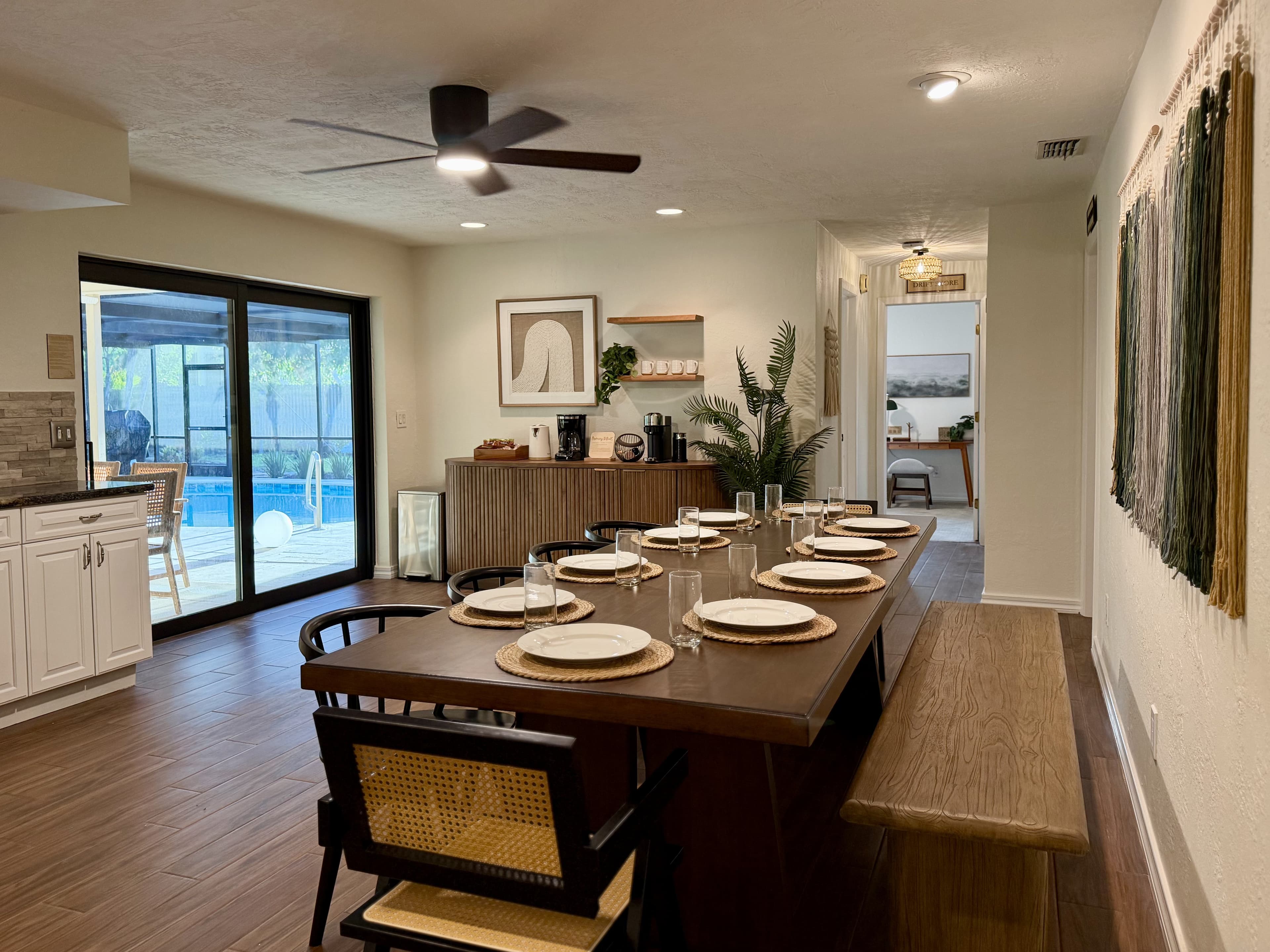 Dining table set for eight with kitchen view
