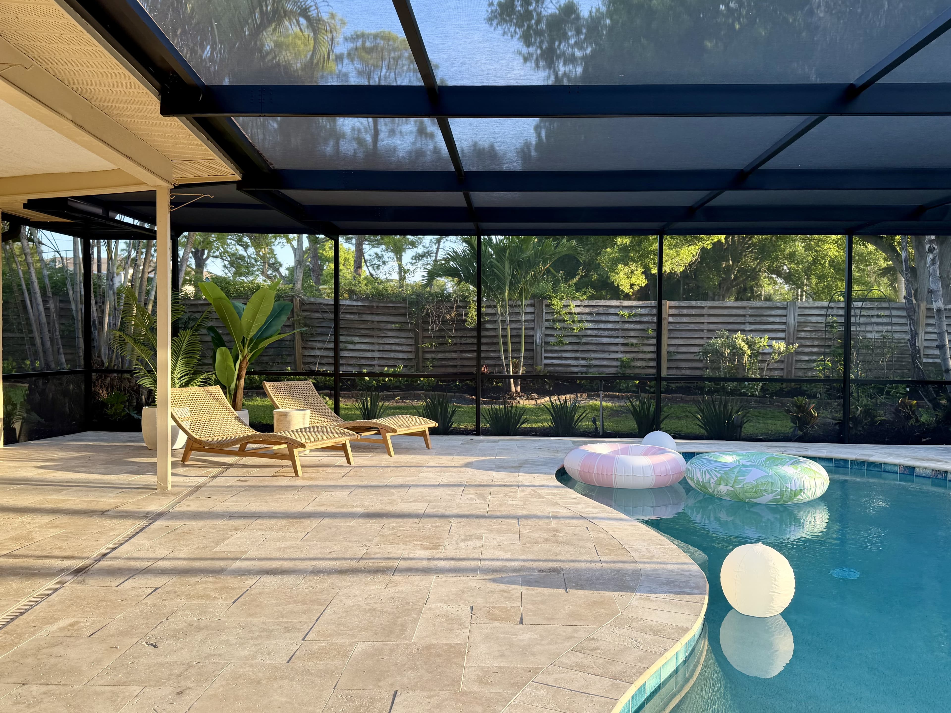 Pool at golden hour with pastel floats