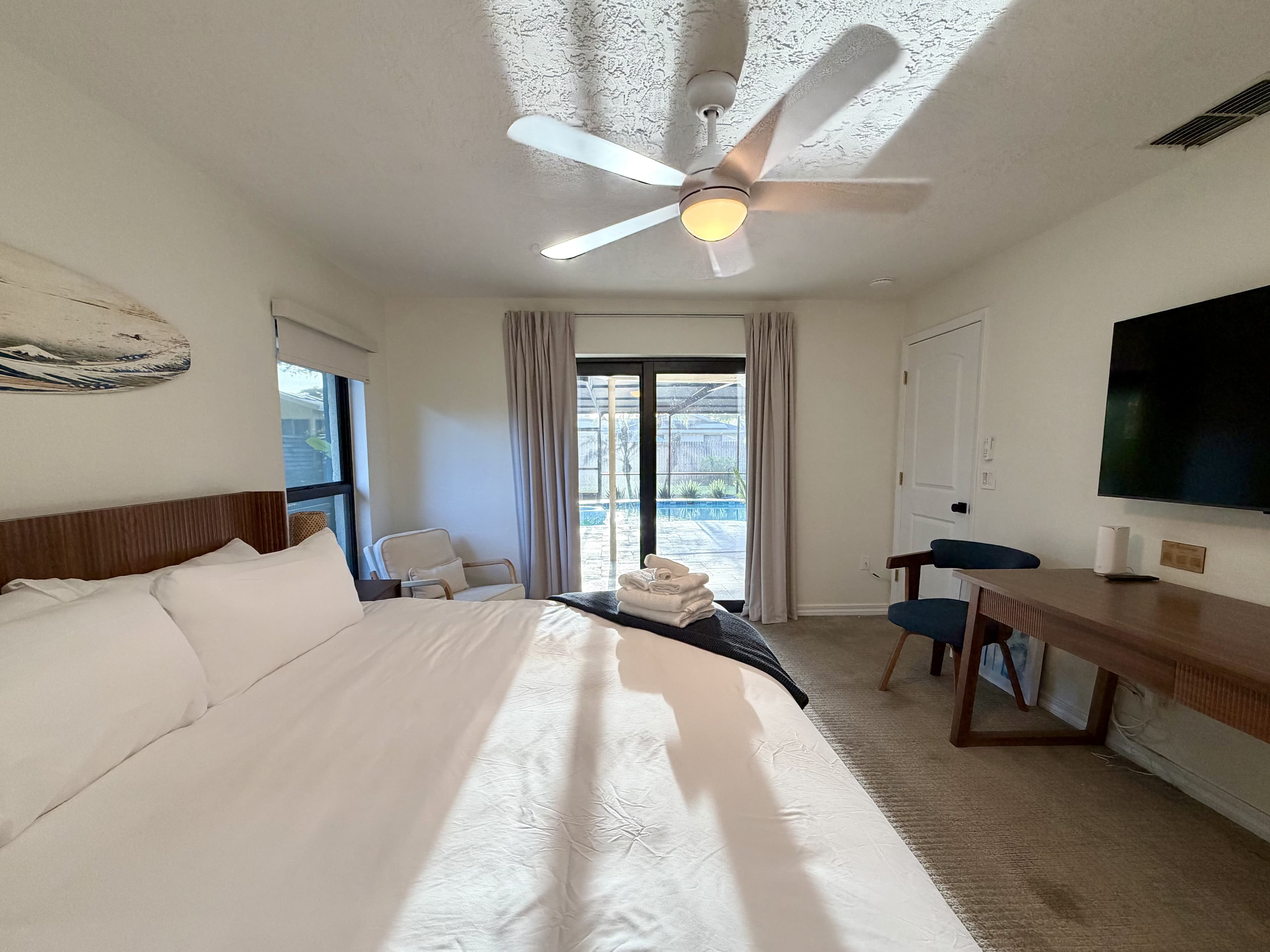 surf suite with pool view through sliding doors